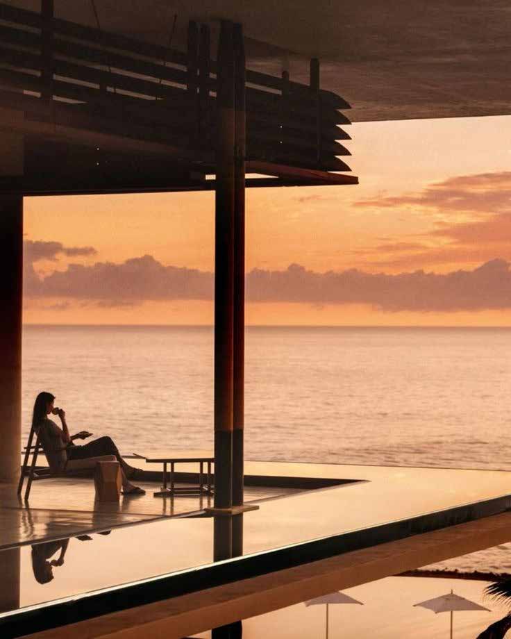 Mujer descansando en una terraza frente al mar al atardecer